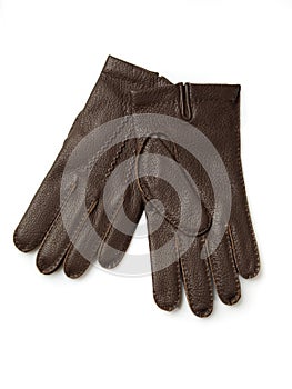Brown leather gloves on white