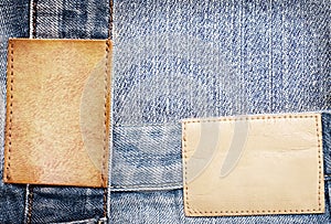 Brown leather jeans labels sewed on jeans.