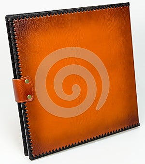 Brown leather photo album cover with decorative frame