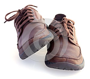 Brown leather shoes isolated over white