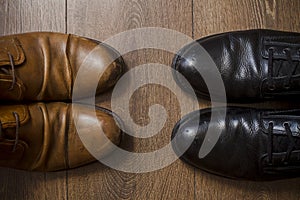 Brown leather shoes on a wooden floor