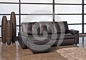Brown leather sofa with stool
