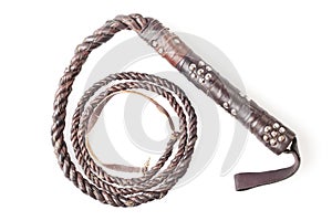 Brown leather whip isolated on white photo