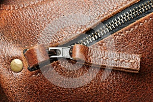 Brown leather zip lock on bag