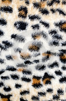 Brown leopard fur pattern as background.