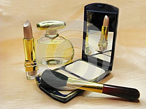 Brown lipstick powder and perfume bottle