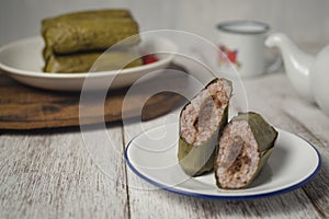 Brown lontong or rice cake with spicy beef floss filling