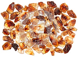 Brown lump cane sugar crystals