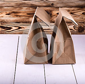 Brown Lunch Bag on white wooden table