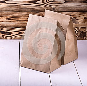 Brown Lunch Bag on white wooden table