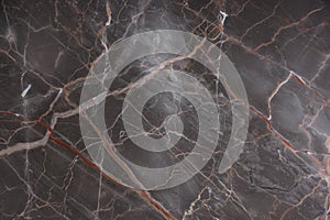 Brown marble with pink and red veins, called Caravaggio photo
