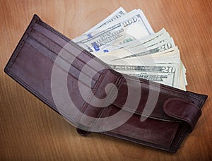 Brown men`s wallet with money