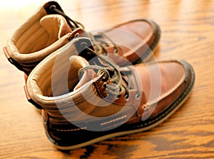 Brown Mens Leather Boots Fashionable on Wood Grain