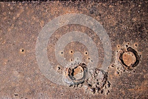 Brown metal sheet with two funnels photo