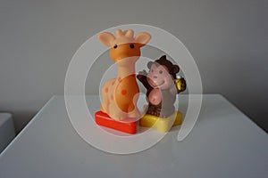 Brown monkey and orange giraffe toys for children