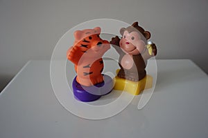 Brown monkey and orange tiger toys for children