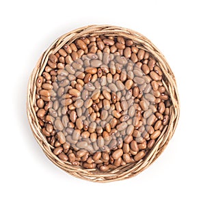 Brown Mulatinho Beans into a basket