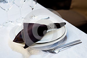 Brown napkin, table settings. Wedding, banquet. Indoor