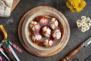 Brown natural Easter eggs in a basket, top view