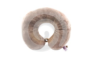 Brown neck pillows for travelling on white background.