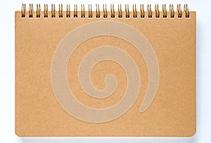 Brown notebook paper on white background.