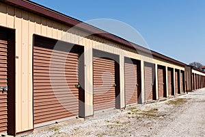 Brown numbered self storage and mini storage garage units IV