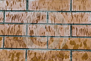 Brown old dirty brick wall consists of rectangular blocks background base