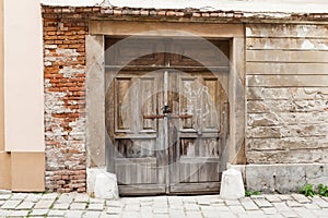 Brown old rustic withered wooden doors