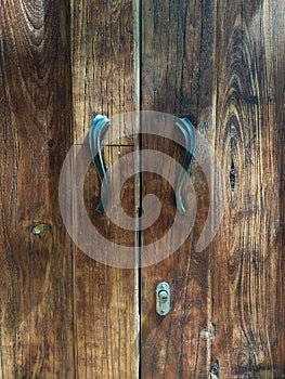 Brown old wooden door texture with two handle