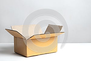 Brown open box supplies on white background, cardboard box for product transport shipping