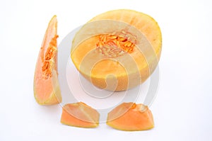 The brown orenge colour muskmelon half and cutt piece isolated in white background