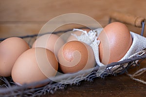 Brown organic freshly collected farm eggs in vintage box . Easter Composition in Rustic Authentic Style. Selected focus. Copy
