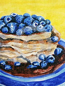 Brown pancakes with chocolate serup and blueberries in blue plate on the yellow background