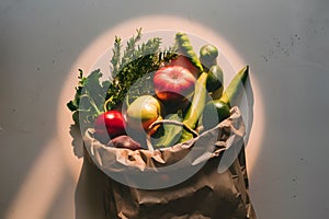 Brown paper bag of fresh produce on light surface with soft glow Wholesome ingredients