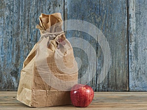 brown paper bag on wooden background