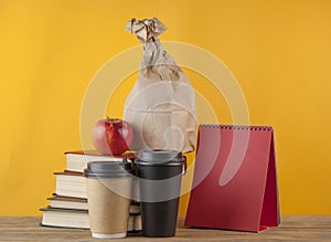 Brown paper bag on wooden background