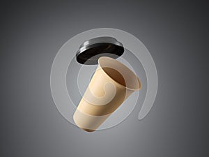 Brown paper cup with plastic top on the gray