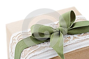 Brown paper package tied up with lace