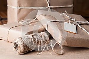 Brown paper packages wrapped up with string