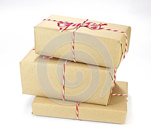 Brown paper parcel tied with red and white string