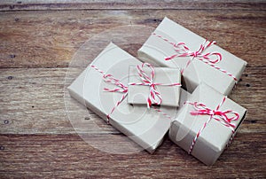 Brown paper parcel tied with red and white string