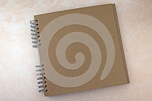 Brown paper scrapbook with ring bind