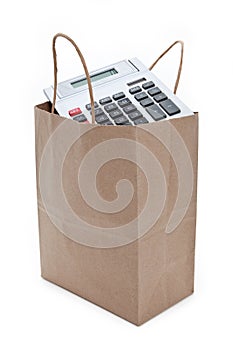 Brown paper shopping bag and calculator