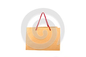 Brown paper shopping bag with red handle robe isolated on white background