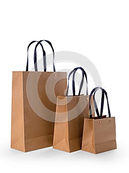 Brown paper shopping bags isolated on white background