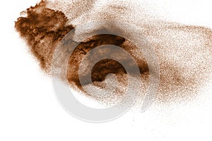 Brown particles splattered on white background.