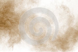 Brown particles splattered on white background