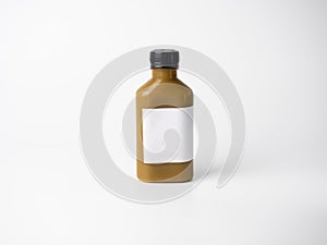 Brown pastel color drink in plastic bottle container with empty logo label. mixed many vegetables and fruits smoothie juice on stu