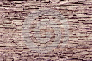 Brown pattern of decorative brown grey slate stone wall surface