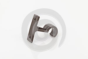 Brown plastic support for curtain poles on white background